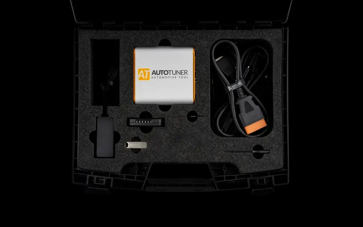 Autotuner remapping tool in its case with OBD cable and bench and boot adapters